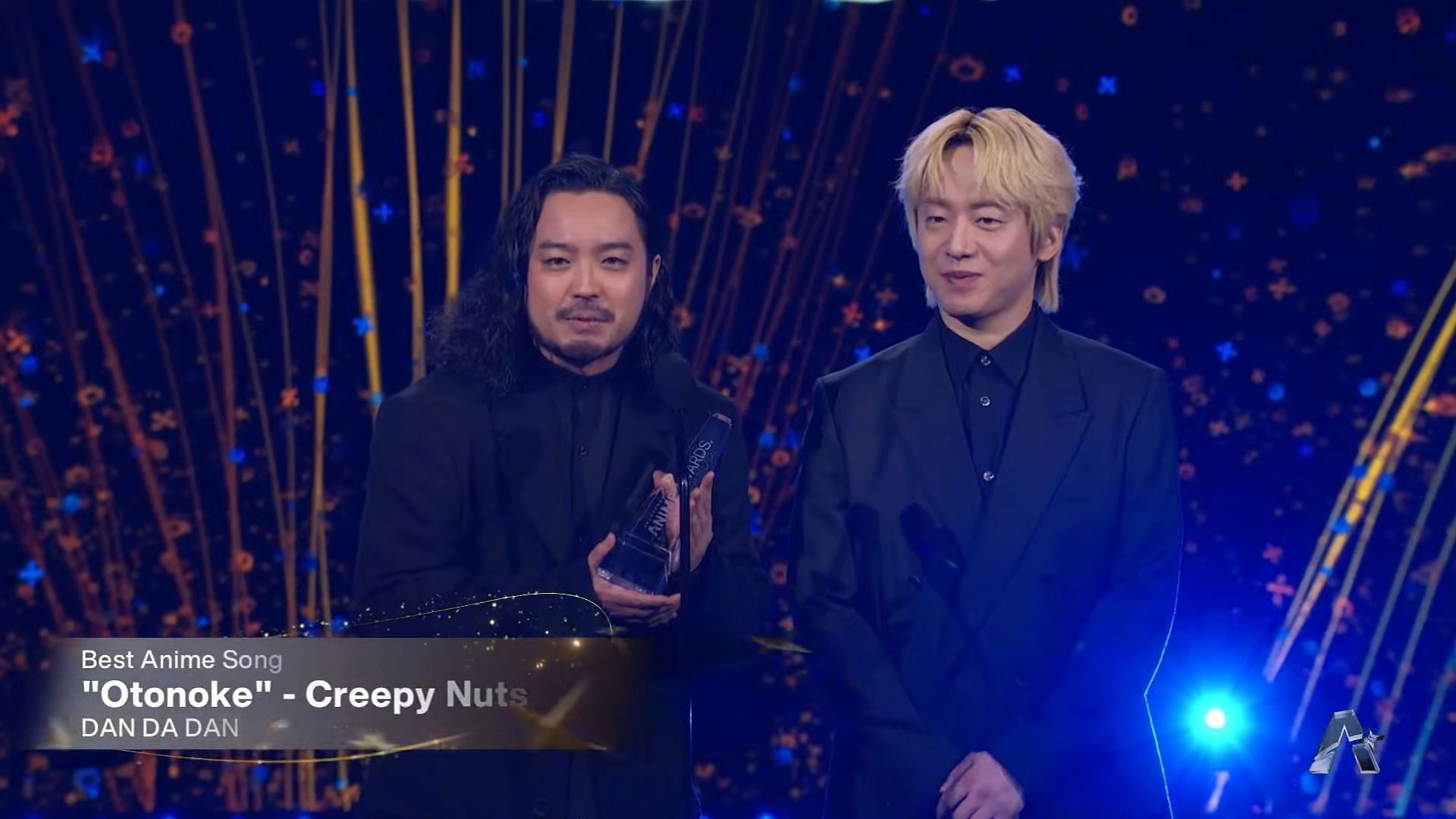 Creepy Nuts accepting the award for "Otonoke" as the best anime song (Image via Crunchyroll)